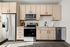 Furnished studio kitchen with light wood cabinets
