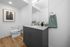 Bathroom with gray cabinets