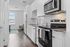 furnished kitchen area in studio apartment