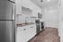 furnished kitchen area in studio apartment
