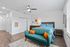 furnished living room and bedroom area of studio apartment