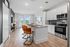 furnished kitchen with island and appliances in apartment