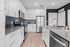 furnished kitchen with island and appliances in apartment