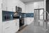 furnished kitchen with island and appliances in apartment