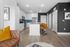 furnished living and kitchen with island in apartment