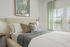Furnished bedroom with bed and side tables