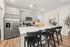 Furnished kitchen with large island and grey cabinets