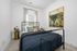 Guest bedroom with bed and side tables