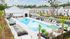 Community pool with lounge chairs