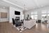 Clubroom fireplace with chairs and tables