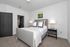 Second bedroom with bed and sidetables