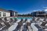 Swimming pool with chairs on a sunny day
