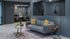 Chic lounge with a modern gray sofa, colorful pillows, sleek floor lamp, and stylish decor in a cozy setting.