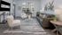Modern living room with sleek furniture, artistic decor, and abundant natural light.