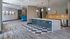 Modern lounge area with stylish bar seating, geometric flooring, and contemporary decor.