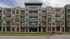 Contemporary apartment building featuring stylish balconies and lush palm trees.