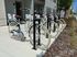 Row of sleek bicycles parked outside a modern apartment complex, highlighting convenient transportation options.