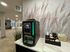 Chic coffee station setup in a modern apartment lobby with a Necta coffee machine and snacks.