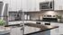 Sleek kitchen with stainless steel appliances, polished countertops, and stylish cabinetry.