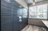 Modern package room with secure lockers and natural lighting from large windows.