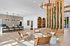 Contemporary community lounge with stylish seating, lush greenery accents, and a welcoming atmosphere.