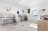 Bright pet washing station with stainless steel baths and modern decor.