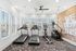 Bright and modern fitness room featuring treadmills, an elliptical, and a stair climber with motivational wall art.