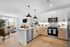 Elegant and bright open-concept kitchen and living area with modern appliances and stylish decor.