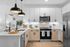 Bright modern kitchen with sleek white cabinets, stainless steel appliances, and stylish pendant lights.