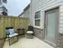 Back patio with chairs and a table