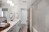 Guest bathroom with shower/tub combo and double vanity