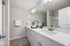 Guest bathroom with shower/tub combo and double vanity
