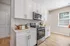 Kitchen with white cabinets and stainless steel appliances