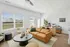 decorated living room with lots of natural light