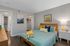 Charming bedroom with elegant wooden furniture, cozy bedding, and ample storage, offering a stylish and comfortable living space.