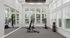 Bright and modern home gym featuring peloton bikes, free weights, and extensive mirror paneling for a luxurious workout experience.