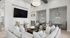 Elegant living room featuring plush seating, stylish decor, and cozy nooks with pendant lighting.