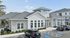 Modern community center with a stylish design, ample parking, and a welcoming entrance, perfect for gatherings and events.